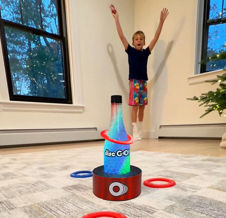 A child celebrating a disc GO! toss